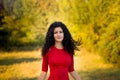Happy beautiful young woman in red dress relax in summer park. Freedom concept Royalty Free Stock Photo