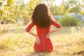 Happy beautiful young woman in red dress relax in summer park. Freedom concept Royalty Free Stock Photo