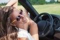 Happy beautiful young woman sitting in a car Royalty Free Stock Photo