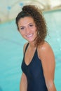 happy beautiful young woman sitting near swiming pool Royalty Free Stock Photo