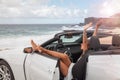 Happy beautiful young woman sitting in a sports car Royalty Free Stock Photo