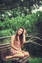 Happy beautiful young woman in spring blossom park. Royalty Free Stock Photo