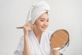 Happy beauty blogger concept, cute asian young woman, girl smile, make up face by applying brush blush powder on her cheek, Royalty Free Stock Photo