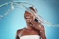 Happy, beauty and splash of water with black woman for shower, health and skincare. Wellness, spa and luxury with girl Royalty Free Stock Photo