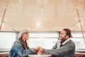 Happy beloved couple holding hands in bus cafe Royalty Free Stock Photo