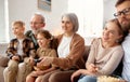 Happy big family watching TV and eating popcorn Royalty Free Stock Photo