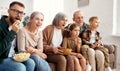 Happy big family watching TV and eating popcorn Royalty Free Stock Photo