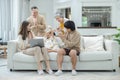 Happy big family Grandfather Grandmother mother father and Granddaughter having fun living room at home. connects relationships Royalty Free Stock Photo