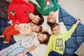 Happy big family is having fun together in bedroom. Large family morning concept. Mother with four kids wear pajamas in bed at Royalty Free Stock Photo