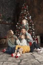 Happy big family at home. Mom dad and children near Christmas tree. Traditional xmas decorated living room. Xmas holiday Royalty Free Stock Photo