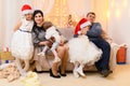 Happy big family portrait, celebrating new year or Christmas - parents and children in home interior decorated with holiday lights Royalty Free Stock Photo