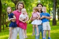 Happy big family of six at summer park Royalty Free Stock Photo