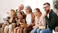 Happy big family watching TV and eating popcorn Royalty Free Stock Photo