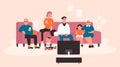 Happy big family watching TV on sofa, enjoying movie film together in home living room Royalty Free Stock Photo