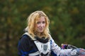 Happy biker woman with a road helmet - portrait of young mx girl, cross bike