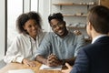 Happy biracial couple have meeting male broker Royalty Free Stock Photo