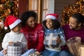 Happy biracial family with kids celebrate New Year Royalty Free Stock Photo