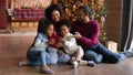 Happy biracial family with kids use cell on Christmas Royalty Free Stock Photo