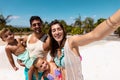 Happy biracial family taking selfie at beach Royalty Free Stock Photo