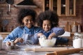 Happy biracial mother and daughter baking in kitchen Royalty Free Stock Photo