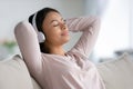 Happy biracial woman in headphones listen to music relaxing Royalty Free Stock Photo