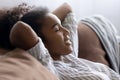 Happy biracial woman relax on sofa in living room Royalty Free Stock Photo