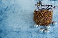 Happy Birthday Almonds Chocolate Cake on Blue Pastel background.