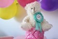 Happy birthday badge on a teddy bear Royalty Free Stock Photo