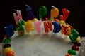 Happy birthday cake with candles on black background Royalty Free Stock Photo