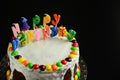 Happy birthday cake with candles on black background Royalty Free Stock Photo