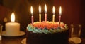 Happy birthday cake with candles and birthday party