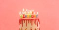 happy birthday cake. happy birthday candles. Cake on pink background. Royalty Free Stock Photo