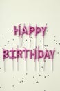 Happy birthday candles and glitter on white background Royalty Free Stock Photo