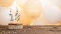 Happy birthday card with candle number 13 in a cupcake against the background of balloons. Copy space happy birthday for thirteen Royalty Free Stock Photo