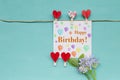 Happy birthday card with red heart clip and purple flower Royalty Free Stock Photo
