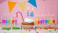 Happy birthday card to of eighteen years old on a pink background, with a figure in a cupcake. Beautiful happy birthday background Royalty Free Stock Photo