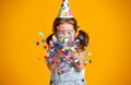 Happy birthday child girl with confetti on yellow background