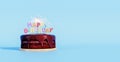 Happy Birthday chocolate cake with sparkles on blue background Royalty Free Stock Photo