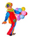 Happy birthday clown holding bunch of balloons.