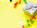 Happy birthday concept.Gift box with multi-colored confetti on a yellow background. Royalty Free Stock Photo