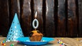 Happy birthday with a cupcake and a burning candle. Happy birthday anniversary 0