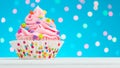 Happy Birthday cupcake. Tasty cupcakes with pink cream icing and colored sprinkles. Sweet delicious dessert on white wooden table Royalty Free Stock Photo