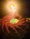 Happy birthday cupvake with a candle in the dark Royalty Free Stock Photo