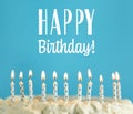 Happy Birthday! Delicious cake with burning candles on blue background Royalty Free Stock Photo