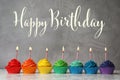 Happy Birthday! Delicious cupcakes with candles on table Royalty Free Stock Photo