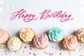 Happy Birthday. Flat lay composition with tasty cupcakes on white background Royalty Free Stock Photo