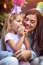 Birthday girl  celebrate birthday and  eating apple with her mother Royalty Free Stock Photo