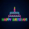 Happy birthday glowing neon sign with cake, candle and comic inscription. Birthday cake celebration symbol in neon style