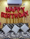 Happy Birthday Golden Balloon Hanging Banner on Wall Royalty Free Stock Photo