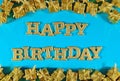 Happy birthday golden text and golden gifts on a blue Royalty Free Stock Photo